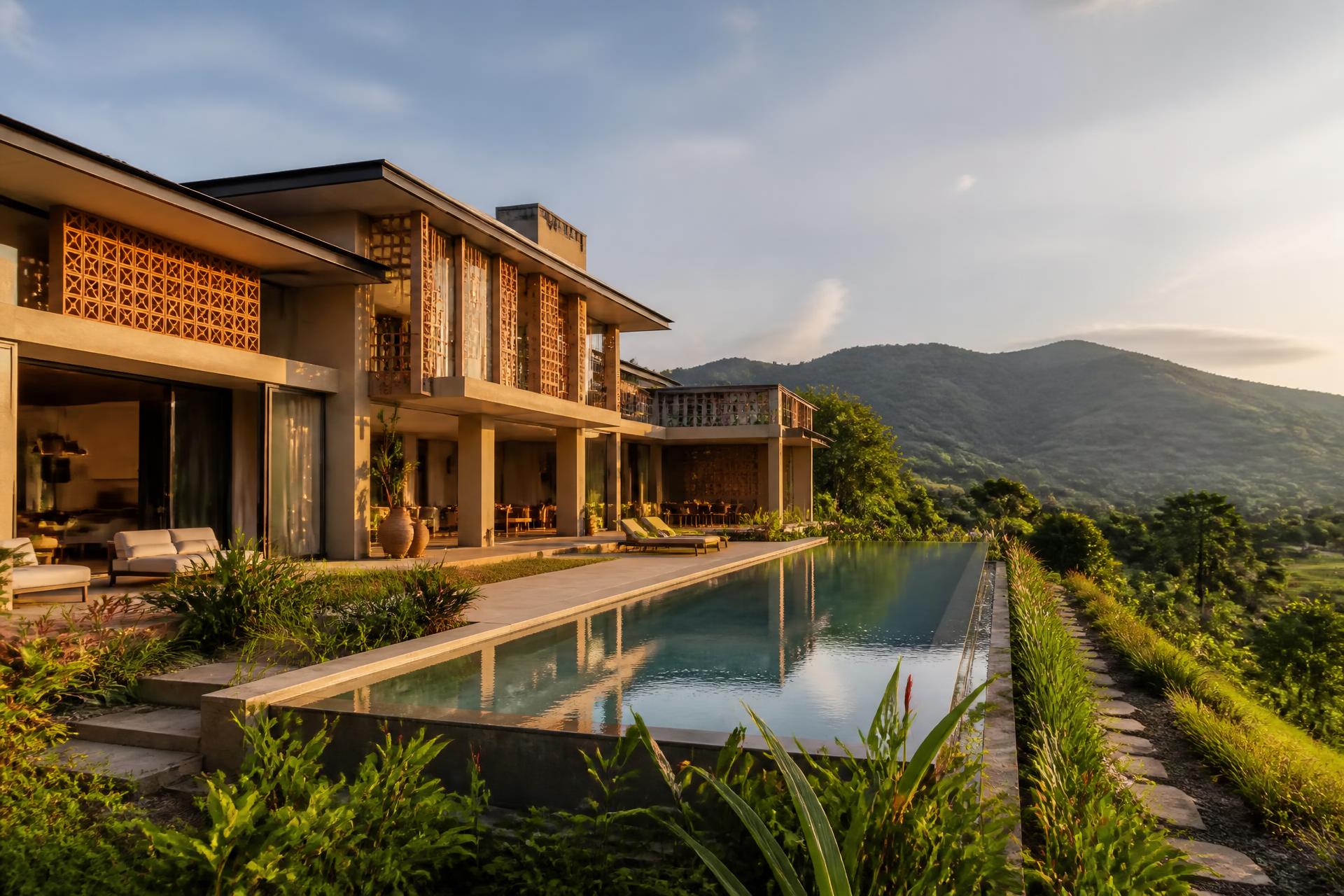 Afro-contemporary villa at golden hour above the Eastern Region highlands